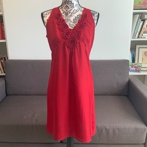 Elegant Red Sleeveless Dress with Rosette Detail